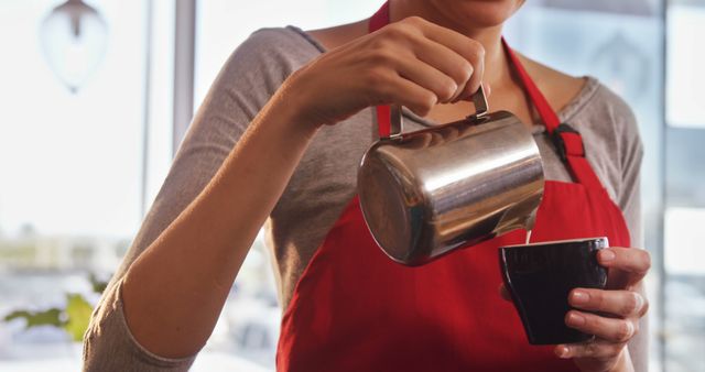 Barista Pouring Fresh Coffee Milk Froth with Red Apron - Download Free Stock Images Pikwizard.com