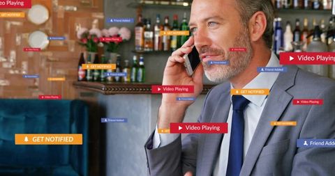 Executive Making Phone Call in Lounge Surrounded by Floating Social Media Notifications
