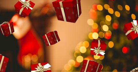 Christmas Presents Falling with Golden Lights and Decorated Tree - Download Free Stock Images Pikwizard.com