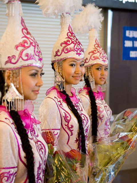 Girls in traditional Kazakhstan dress await the arrival of the Soyuz TMA-18 crew at the Karaganda airport in Kazakhstan. The Soyuz TMA-18 spacecraft, carrying Expedition 24 Commander Alexander Skvortsov and Flight Engineers Tracy Caldwell Dyson and Mikhail Kornienko, landed, near the town of Arkalyk, Kazakhstan on Saturday, Sept. 25, 2010.  Russian Cosmonauts Skvortsov and Kornienko and NASA Astronaut Caldwell Dyson, are returning from six months onboard the International Space Station where they served as members of the Expedition 23 and 24 crews. Photo Credit: (NASA/Bill Ingalls)
