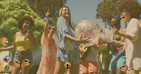Cheerful friends enjoying summer garden party