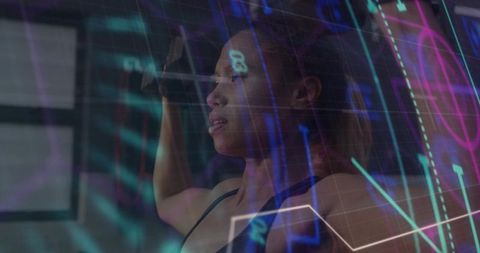 Female athlete lifting dumbbell overhead with neon data overlay for fitness analytics