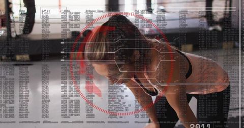 Recovering athletic woman leaning on knees after workout with red HUD fitness data overlay