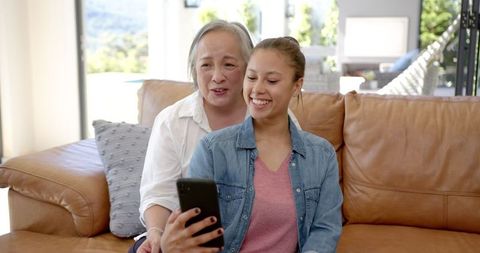 Grandmother and granddaughter enjoying video call together