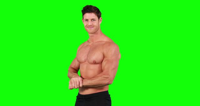 Man flexing muscles with a green background, showcasing athleticism and health. Useful for fitness, bodybuilding, health and wellness promotions, exercise guides, and athletic training materials.