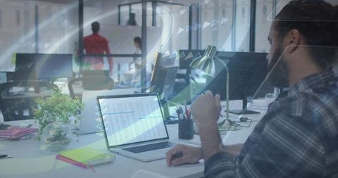 Modern Office Worker Collaborating in Innovative Workspace with Laptop