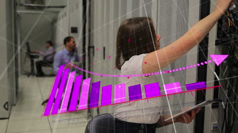 Technicians Working with Digital Data Graph in Server Room