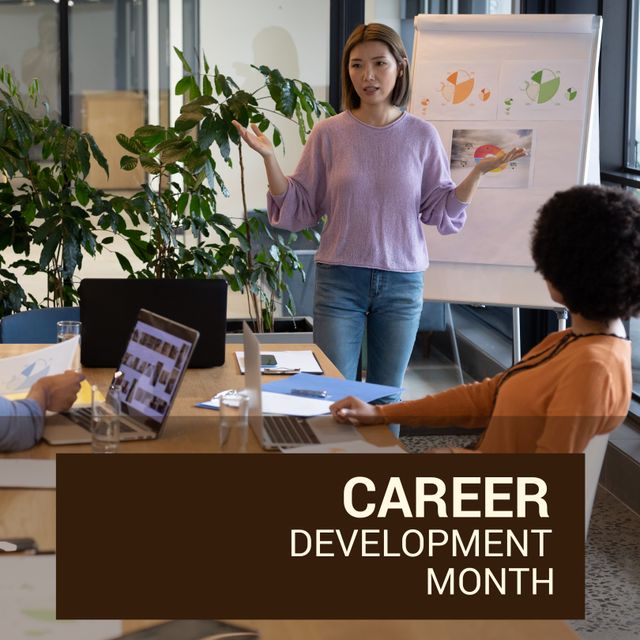 Image of career development month over asian woman making presentation in office. Business, work, career and development concept.