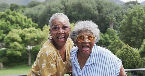 Joyful African American Women Enjoying Summer Together on Balcony