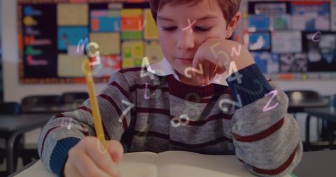 Studious Boy Absorbed with Numbers and Learning Concepts in Classroom