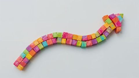 Colorful geometric curved arrow of success with block cubes