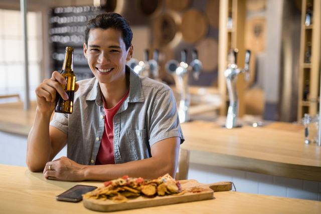 Portrait of man having beer in a restaurant