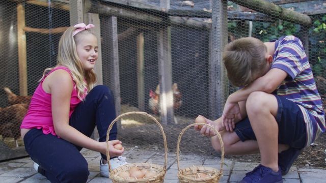 Two children, a brother and sister, are gathering eggs from a chicken coop and placing them into wicker baskets. This scene captures a playful and educational experience in a backyard or farm setting. Use this for themes related to family activities, rural life, sustainability, or outdoor fun.