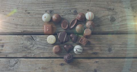 Assorted Chocolates Arranged in Heart Shape on Rustic Table - Download Free Stock Images Pikwizard.com