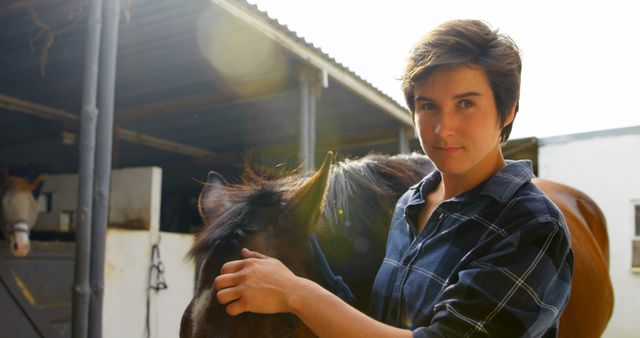 Woman Petting Horse Near Stable Enjoying Sunny Day - Download Free Stock Images Pikwizard.com