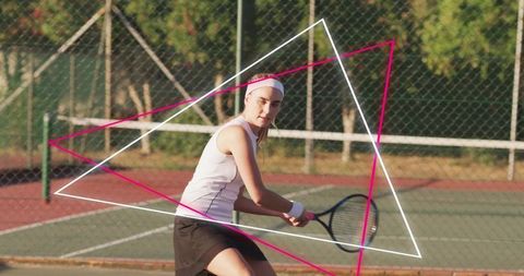 Female tennis player hitting two-handed backhand on outdoor court with vibrant neon shapes