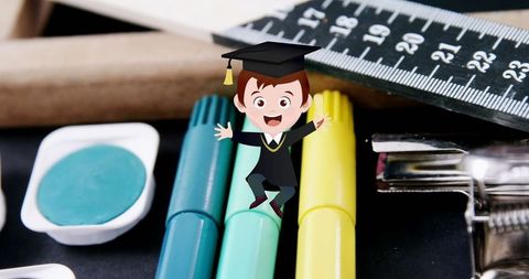 Excited Schoolboy Cartoon Balancing on Stationery Supplies - Download Free Stock Images Pikwizard.com