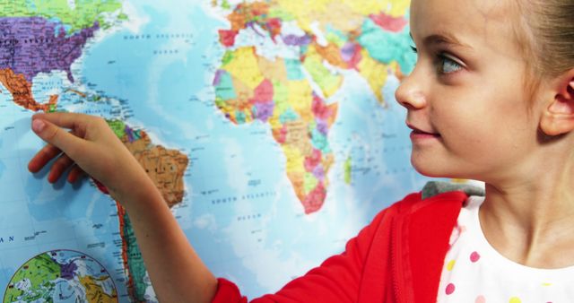 Young Girl Pointing at World Map in Geography Class - Download Free Stock Images Pikwizard.com