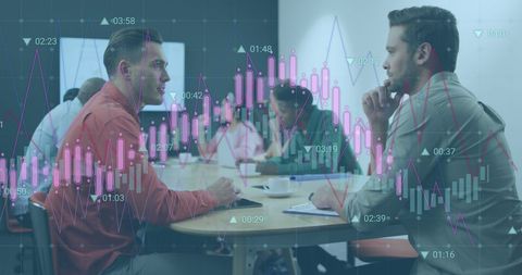Business Colleagues Analyzing Data with Stock Charts Overlay