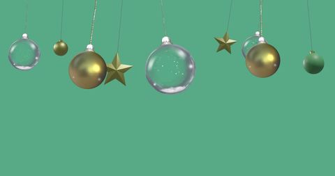 Hanging Christmas Baubles and Stars on Green Background