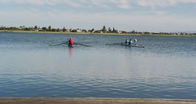 Two Rowers Practicing on Calm Lake Under Blue Sky - Download Free Stock Images Pikwizard.com