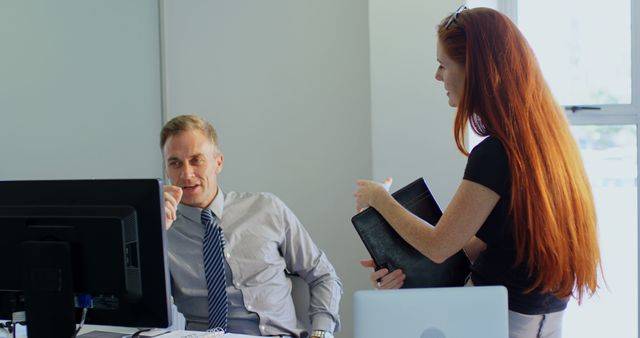 Office Coworkers Discussing Project Ideas at Workstation - Download Free Stock Images Pikwizard.com