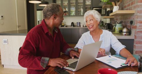 Senior Couple Discussing Finances in Modern Kitchen - Download Free Stock Images Pikwizard.com