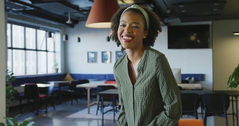 Smiling African American Woman in Modern Office Environment - Download Free Stock Images Pikwizard.com