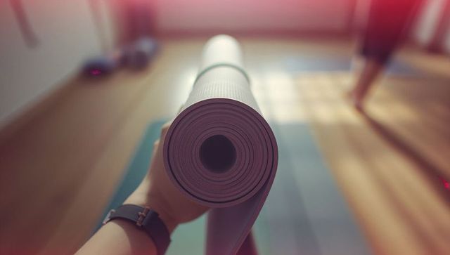 Preparing Mindful Yoga Session at Serene Studio