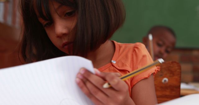 Young Students Focusing on Schoolwork in Classroom - Download Free Stock Images Pikwizard.com