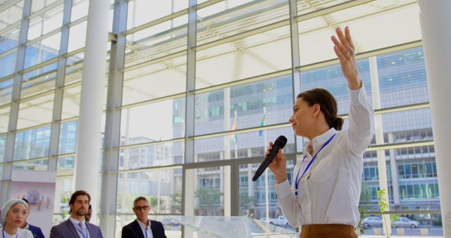 Businesswoman Speaking at Conference in Modern Office Building - Download Free Stock Images Pikwizard.com