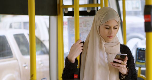 Woman in hijab talking on mobile phone in the bus 4k
