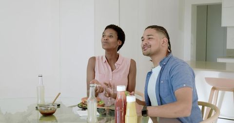 Couple Enjoying Meal Together in Modern Home Setting