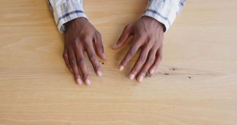 Business Professional Gesturing Hands on Wooden Desk during Discussion