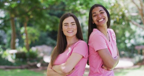 Smiling Women with Cancer Awareness Ribbons in Park - Download Free Stock Images Pikwizard.com