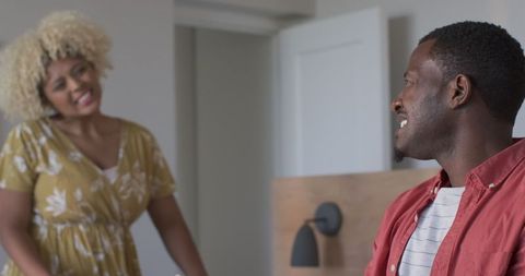 Couple sharing laughter in relaxed home environment