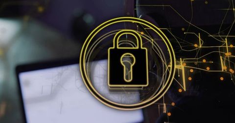 Golden padlock symbol over laptop conveying digital security
