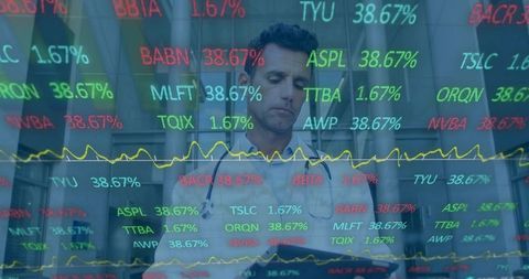 Doctor analyzing medical data on tablet in hospital corridor