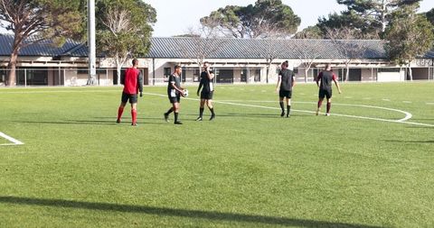 Soccer Team Engaging in Strategic Field Play