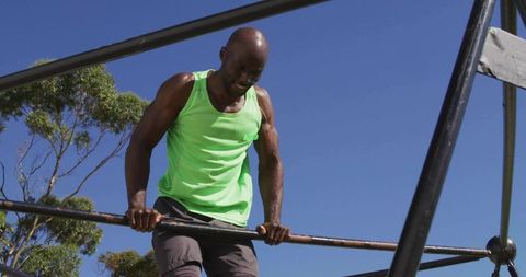 Man Performing Exercise on Outdoor Fitness Bars