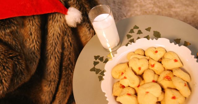 Christmas cookies on plate with a glass of milk on table during christmas time 4k