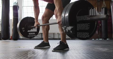 Male Athlete Deadlifting Heavy Barbell on Rubber Floor with Performance Data Overlay