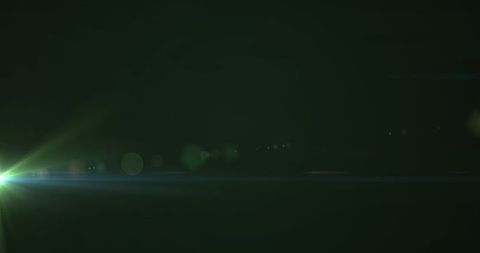 Vibrant Green Lens Flare Across Abstract Black Backdrop - Download Free Stock Images Pikwizard.com