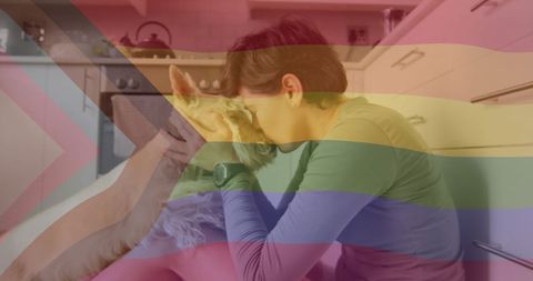 LGBTQ Pride and Affection: Person and Dog in Home Kitchen