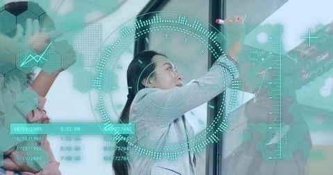 Innovative Businesswoman Writing Data Charts in Modern Office