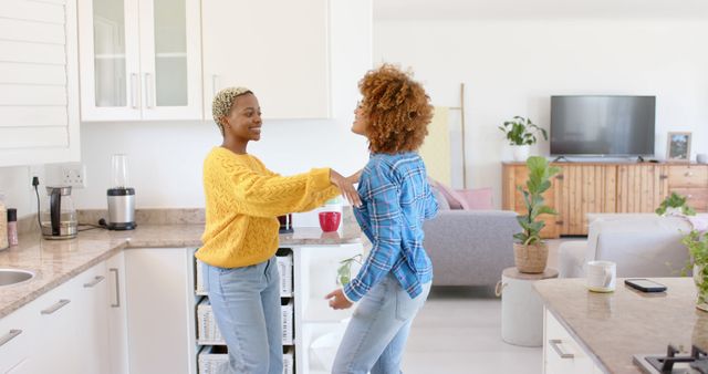 Smiling Friends Dancing Together in Modern Home Kitchen - Download Free Stock Images Pikwizard.com