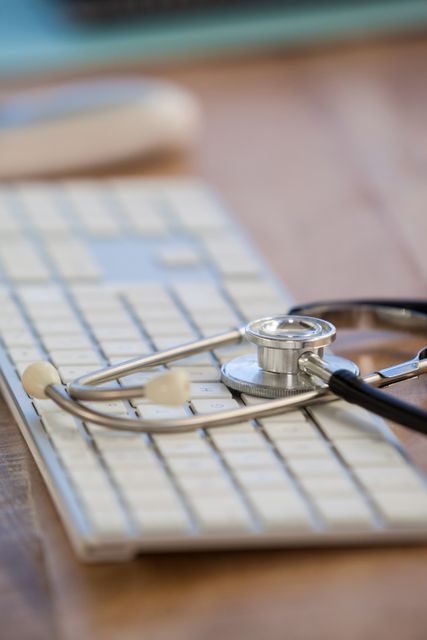This image shows a stethoscope placed on a keyboard, symbolizing the integration of technology in healthcare. It can be used in articles, blogs, or presentations about digital health, telemedicine, medical technology, or modern healthcare practices.