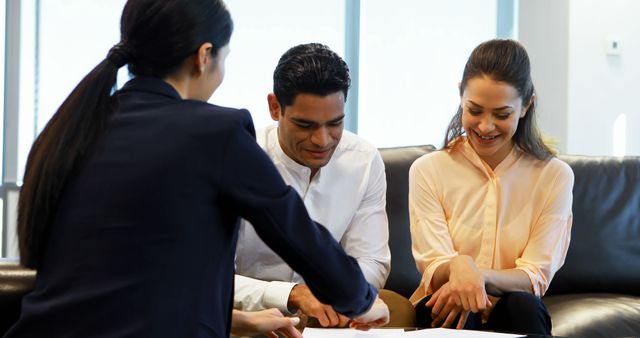 Business Meeting with Happy Diverse Colleagues Reviewing Documents - Download Free Stock Images Pikwizard.com