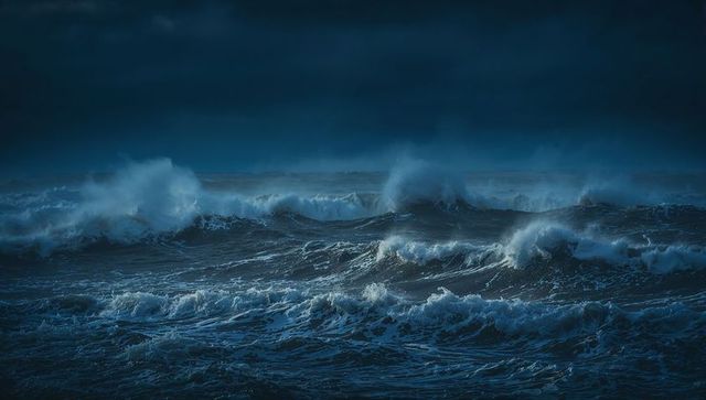 Raging Ocean Waves Under Dark Night Sky