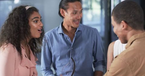 Diverse Colleagues Celebrating Success in Office Environment